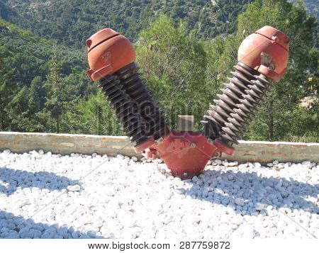 Large Twin High Voltage Insulater Used As Decoration Near El Chorro Hydroelectric Powerstation