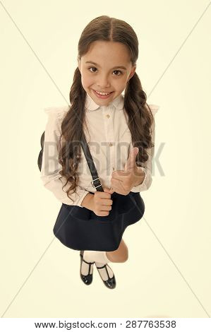 Highly Recommend. Schoolgirl Shows Thumb Up Gesture, Isolated White Background. Girl Happy Smiling R
