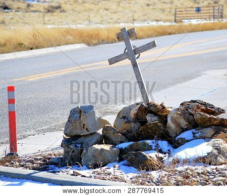 Highway Death Cross In Memory Of Victims In A Car Accident That Took A Life In The Winter Snow.