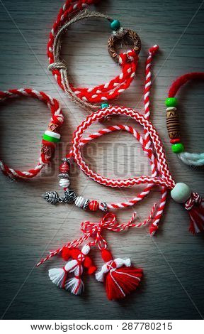 Bulgarian Traditional Spring Decor Martenitsa Bracelets, Wooden Background. Baba Marta Holiday, Back