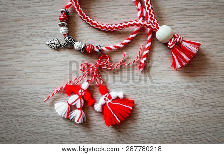 Bulgarian Traditional Spring Decor Martenitsa Bracelets, Wooden Background. Baba Marta Holiday, Back