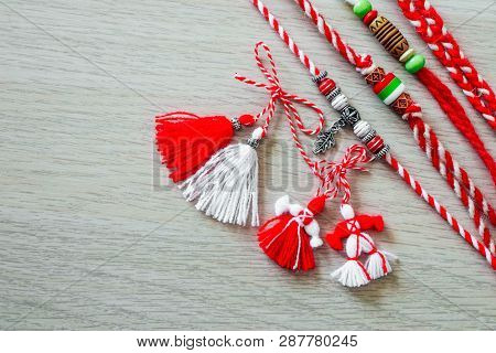 Bulgarian Traditional Spring Decor Martenitsa Bracelets, Wooden Background. Baba Marta Holiday, Back
