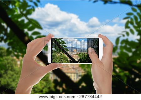 A Man Is Making A Photo Of Duomo Santa Maria Del Fiore From One Public Park. Florence, Italy On A Mo