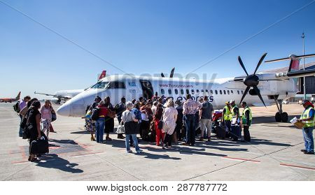 Johannesburg, South Africa, 28th February - 2019: Passengers Waiting To Board A Plane On The Tarmac.