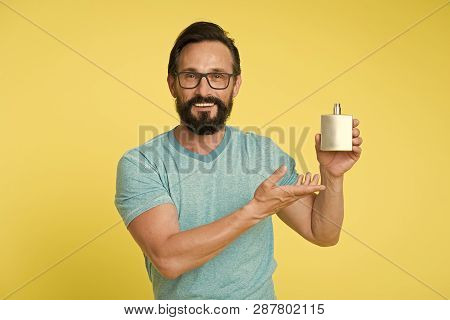 Right Perfume Fragrance Makes You Younger. Man Bearded Handsome Smiling Face Hold Bottle Perfume Def