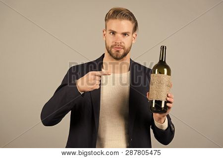 You Should Try This. Man Holds Bottle Alcohol Drink. Social And Cultural Aspects Of Drinking. Busine