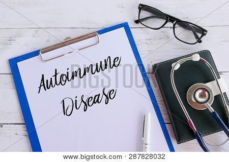 Top View Of Glasses,book,stethoscope,pen,clipboard And Paper Written With Autoimmune Disease. Health
