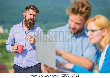 Colleagues Working Laptop, Boss Smoking While Coffee Break On Background. Workaholics Concept. Coupl