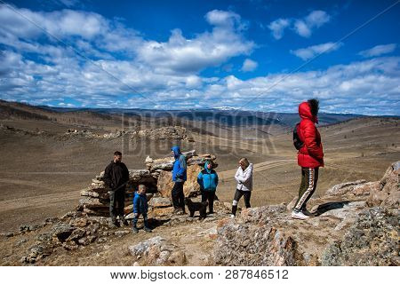 Tazheranskaya Steppe, Russia - April 30, 2018: Wide Steppe With Yellow Grass Under A Blue Sky With W