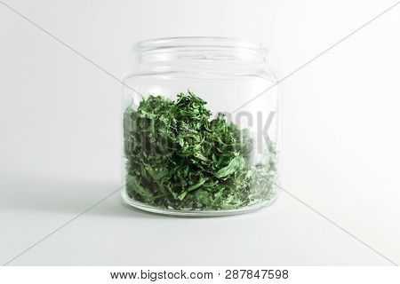 Dry Melissa And Mint Tea In The Jar Isolated On White Background. Homemade And Healthy