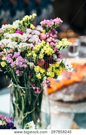 A Bouquet Of Fresh Multicolored Statice Salem Or Limonium Sinuatum Flowers In Violet, Pink, White, Y