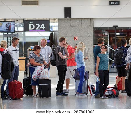 Schwechat, Austria - July 17, 2017. Passengers Standing In Line In The Vienna International Airport 