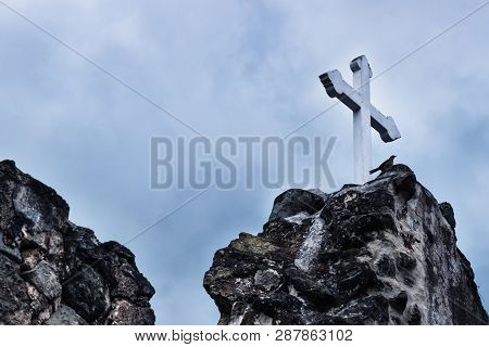 White Cross On Stone Ruins With Dramatic Blue Sky In Hermano Pedro, Antigua, Guatemala