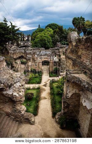 Ruins In Hermano Pedro With Green Garden And Dramatic Sky, Antigua, Guatemala