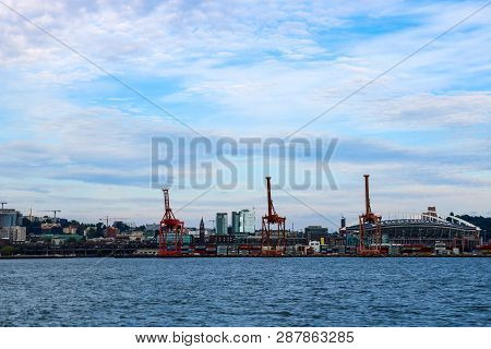 Seattle, Usa, August 31, 2018: Port Of Seattle At Sunset With Cargo Cranes And Centurylink Field.