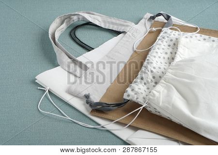 Shopping Bags On Blue Background. Cotton And Paper Bags For Free Plastic Shopping.