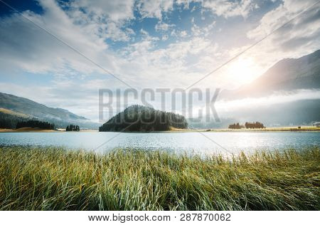 Beautiful alpine lake Champfer in beautiful summer day. Location place Silvaplana village, Swiss alps, district of Maloja, Europe. Scenic image of famous european resort. Discover the beauty of earth.