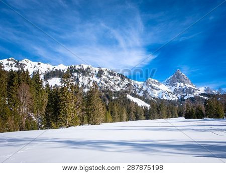 Panoramic View Over Snowy Plateau Kaiserau With Mountain Admonter Kalbling On A Sunny Winterday In S