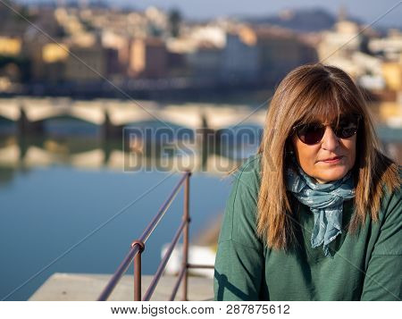 Mature And Beautiful Woman Poses On A Terrace And In Front Of The Florentine Cathedral, Santa Maria 