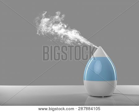 White-blue Air Humidifier. The Unique Design Quickly And Effectively Eliminates Dry Air, Providing A