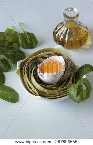 Spinach Paste With Egg And Spinach Leaves On A Blue Background