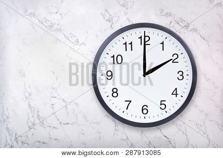 Wall Clock Show Two Oclock On White Marble Texture. Office Clock Show 2pm Or 2am