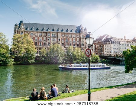 Strasbourg, France - Sep 22, 2017: Friends People On The Bank Of Ill River Having A Picnic On A Summ