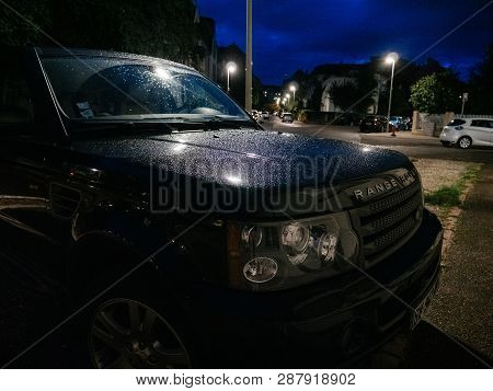 Strasbourg, France - Sep 19, 2017: Front Fiew Of Parked Land Rover Big Suv Covered With Thiny Rain W