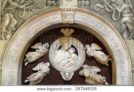FLORENCE, ITALY - JANUARY 10, 2019: Madonna with four angels, Tomb of Filippo Strozzi, marble, by Benedetto da Majano, Santa Maria Novella Principal Dominican church in Florence, Italy