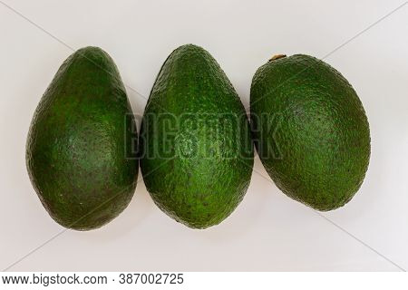 Three Avocado On A White Background. Avocado Macro. Close Up Of An Avacado. Avocado Isolated On Whit