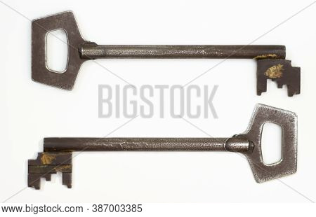 Old Key Isolated. Keys On Table. Ancient Keys, Used For Long Time. Vintage Key On White Background.