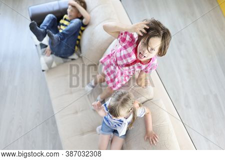 Children Play And Jump On Couch And Have Fun. How To Teach Child To Manage Emotions Concept