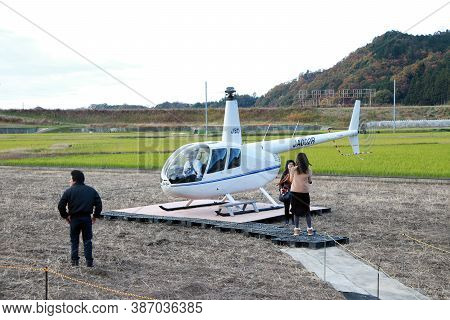 Arashiyama, Kyoto, Japan November 17, 2017: Tourists Are Down From  Helicopter (ja002r - Robinson R4