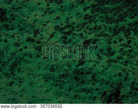 Background Of Old Green Suede Fabric With Stains