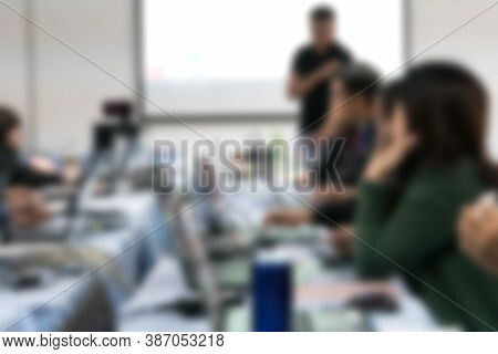 Blurred Of Teacher Groups Computer Training Technology Or Coding Application In Smartphone With Lapt