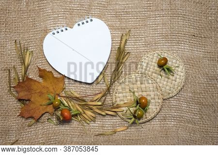 Blank Orange Frame, Yellow Leaves And Seeds On Brown Sackcloth Background. Top View Flat Lay Autumn 