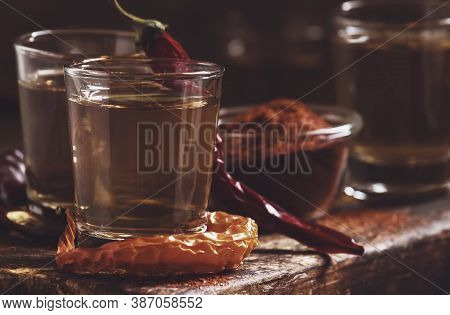 Ukrainian Vodka With Pepper Gorilka, Dark Vintage Wooden Table, Rustic Style, Selective Focus