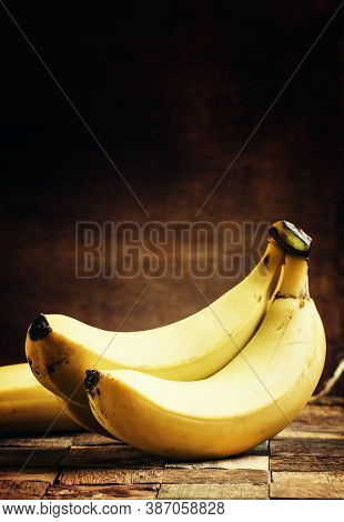 Ripe Bananas On A Vintage Wooden Background, Rustic Style, Selective Focus