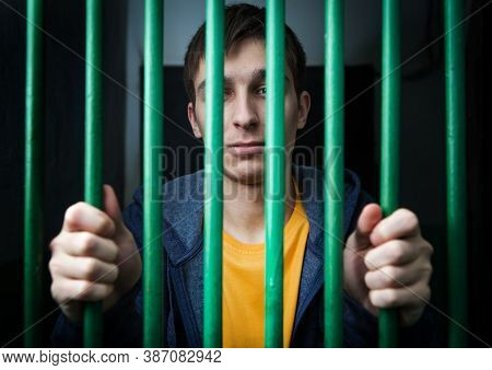Jailed Young Offender Behind Bars In A Cell