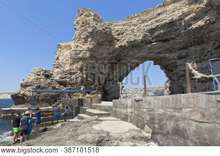 Chernomorsky District, Crimea, Russia - July 21, 2020: Arch Of Cape Big Atlesh - The Main Symbol Of 