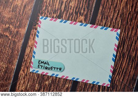 Email Etiquette Write On A White Envelope Isolated On Office Desk.