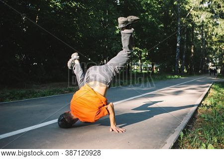 Cool Young Guy Dancing Breakdance On The Road In The Park In Summertime. Breakdancing School Poster