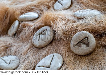 Stone Runes On A Animal Fur. Futhark Viking Alphabet. Close Up Photo Of Norse Runes.