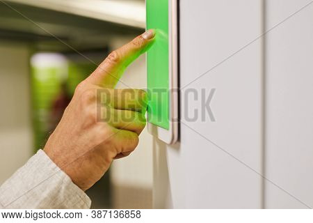 Close Up Of Unrecognizable Man Using Touch Pad With Green Screen While Operating Self Storage Unit, 