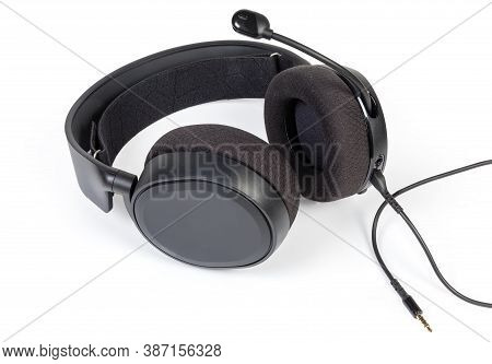 Black Wired High-fidelity Headset With Full Size Headphones And Connected Audio Cable On A White Bac
