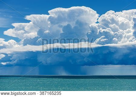 White Clouds In The Blue Sky. Cumulonimbus With Torrential Rain Over The Mediterranean Sea. Gulf Of 