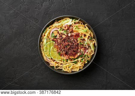 Burmese Atho In Black Bowl On Dark Slate Table Top. Atho Is Myanmar Indian Cuisine Dish Popular In C