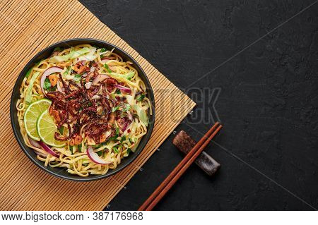 Burmese Atho In Black Bowl On Dark Slate Table Top. Atho Is Myanmar Indian Cuisine Dish Popular In C