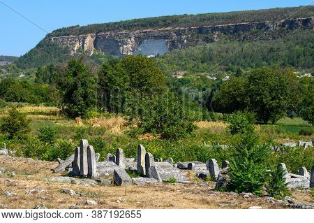 Vadul Rascov, Soldanesti, Moldova, September 2020: Old ruined tombstones at the ancient Jewish cemetery, now abandoned. Jewish communuty was massacred by nazis during WW2.