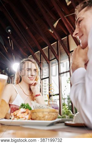 Pretty Young Woman In Love Looking At Boyfriend When Thay Are Having Date In Cafe